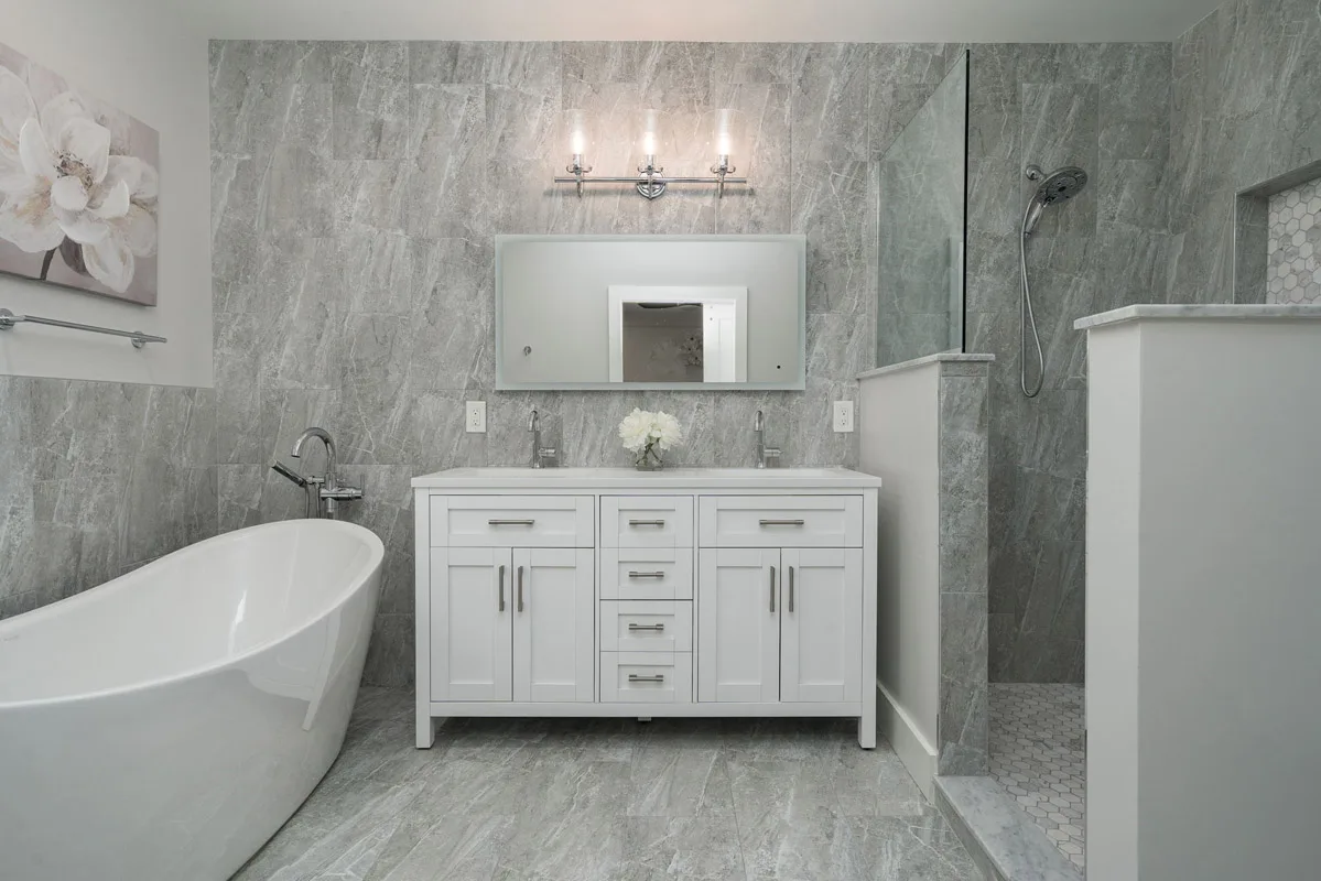 Walk-in shower with marble tile in a Franklin home bathroom