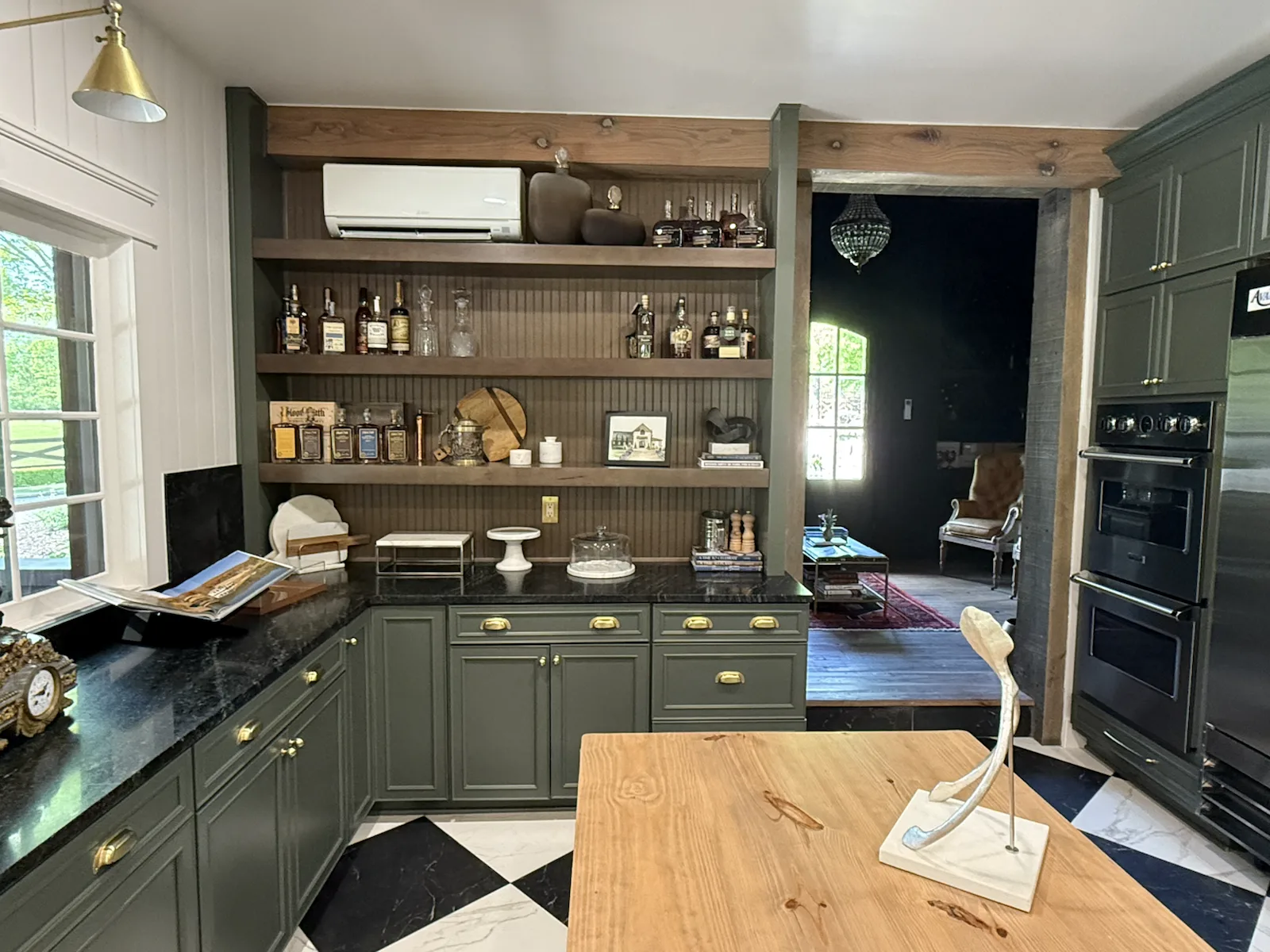 Cortina butler’s pantry with open shelving and an adjoining sitting room