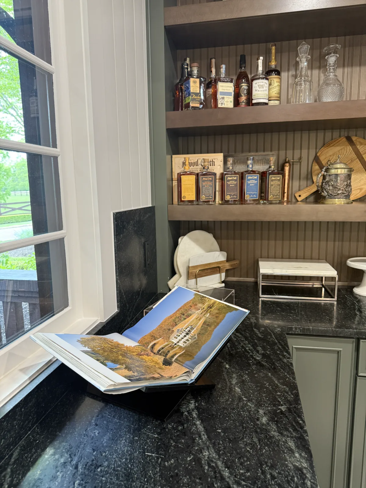 Cortina soapstone counter detail with an open book and styled shelves
