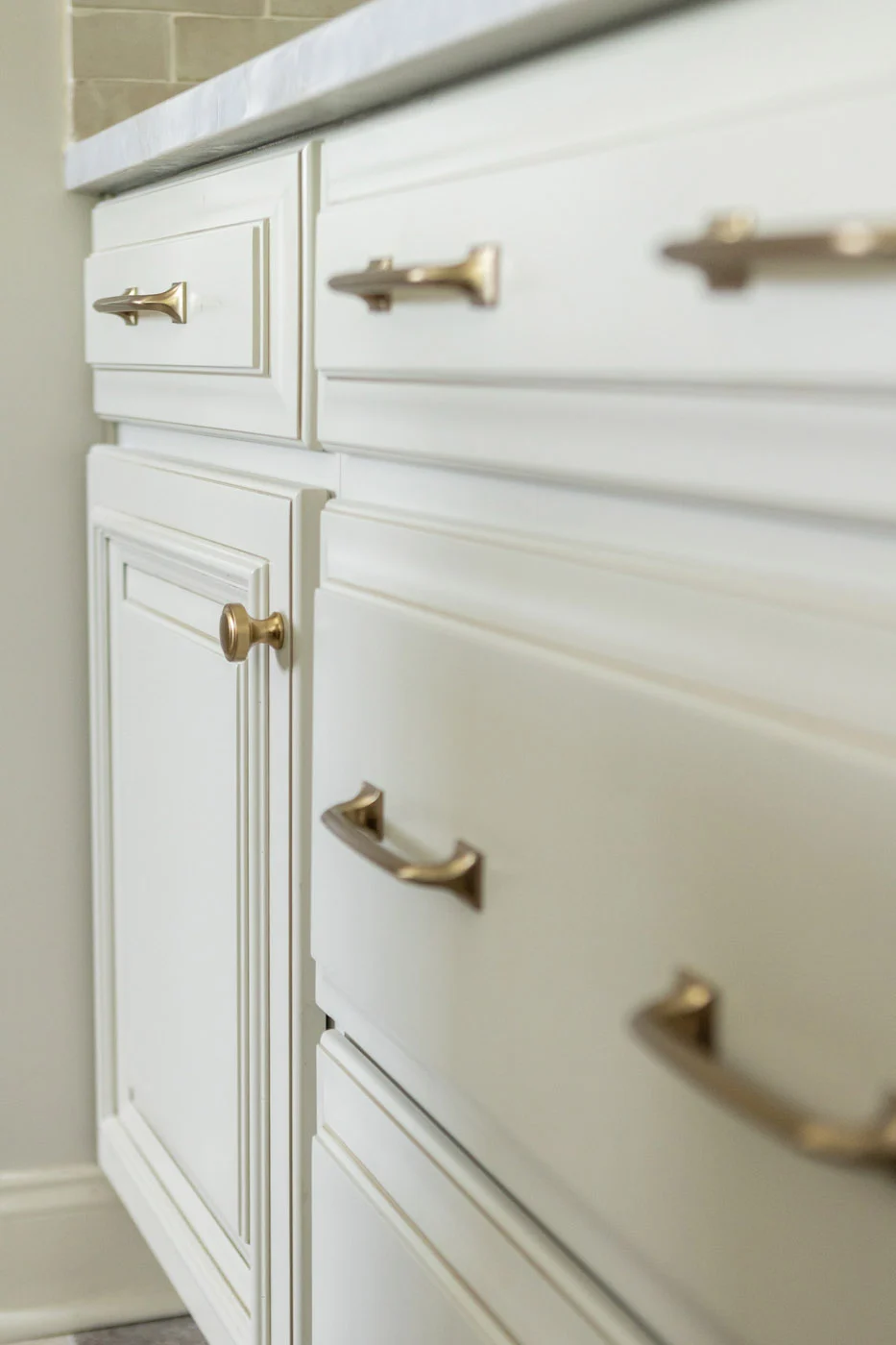 Gweneth kitchen cabinetry with brass hardware