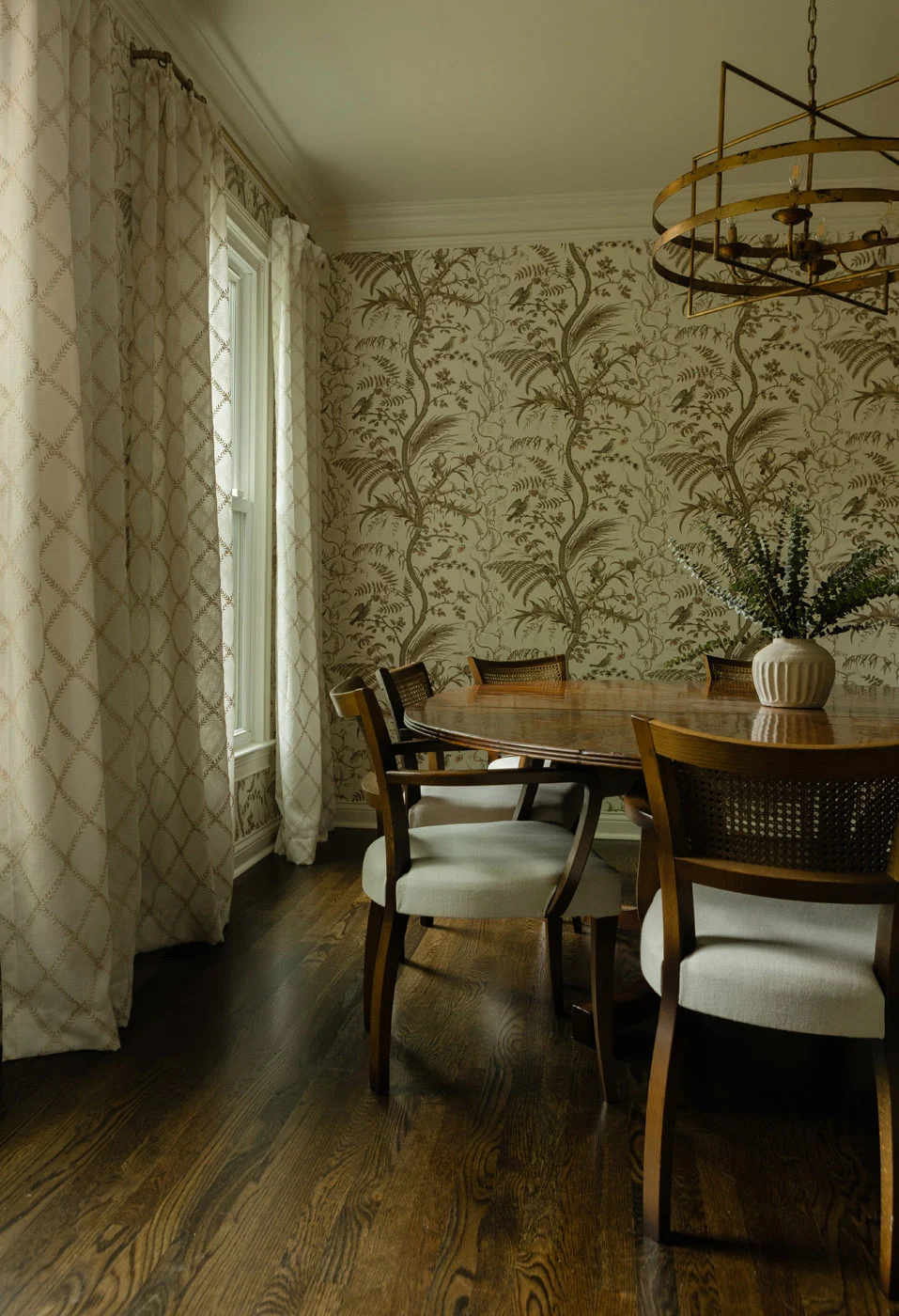 Scotsman dining room with botanical wallpaper and a round table