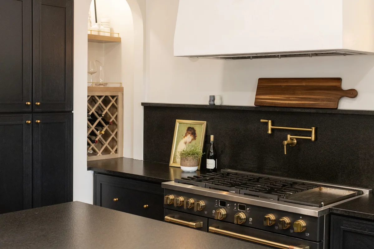Seward Hall kitchen with marble backsplash and brass fixtures